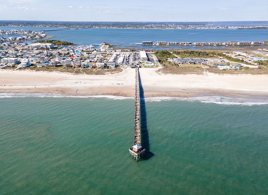 Beaufort, NC - Aerial View of Beaufort, NC With a Long Pier and Beaches on a Sunny Day