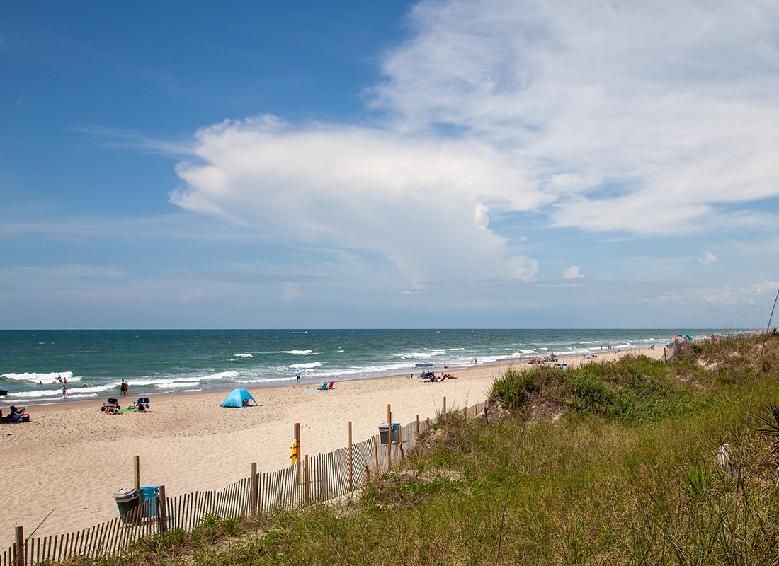 Emerald Isle, NC - Aerial View of Emerald Isle, NC With People Relaxing on a Beach on a Sunny Day